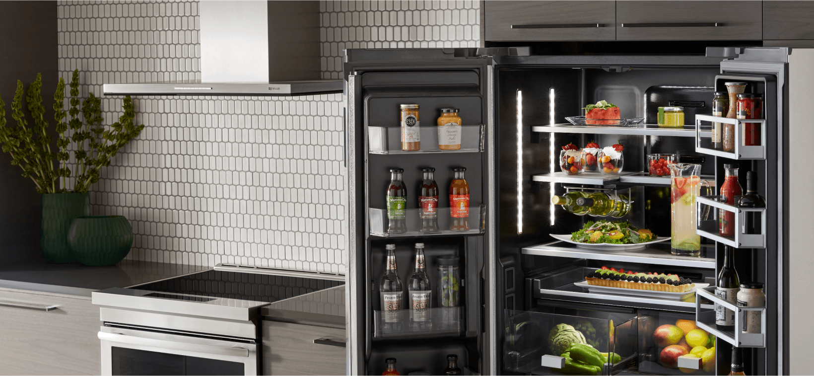 A fully stocked JennAir Freestanding Refrigerator in a sleek kitchen.